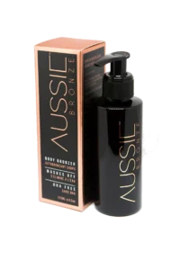 En flaske Aussie Bronze - Instant tanning 125ml bodylotion ved siden af en æske, der fremmer helbred og velvære.